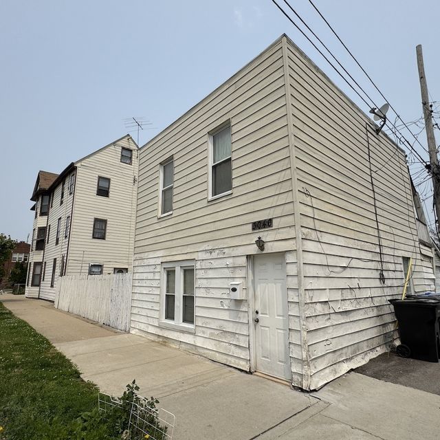 3801 N. Albany Ave.: As bought · rear